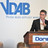 „Pflegegesetz verteilt Probleme nur um“ Stephan Baumann auf der Bühne bei einer VDAB-Veranstaltung