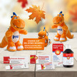 Gesund und günstig durch den Herbst mit Kreussler Pharma Bild im Herbst mit Herbstlaub mit Kuscheltier DYNEX und Kreussler Pharma Produkten