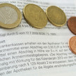 Hessen: Befristeter Abschlag als Kompromiss Euro-Münzen auf gedruckter Seite